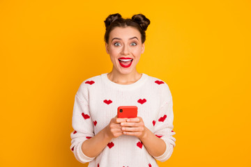Fototapeta na wymiar Close-up portrait of her she nice attractive glamorous charming cute cheerful ecstatic girl using cell 5g app fast speed connection isolated over bright vivid shine vibrant yellow color background