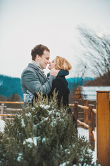 Stylish hipster  young couple outdoor on winter frozen landscape