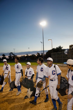 Baseball Players Walking Off Field At Night