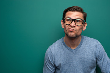 Fototapeta premium Close-up portrait of an annoyed young man