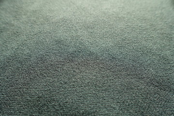 Close view of dark green jersey fabric