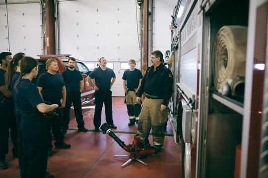 Firefighters Meeting In Fire Station