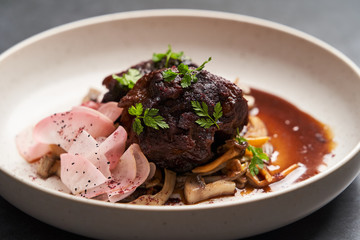Lamb meat with pickled radish, mushrooms and demi glace sauce