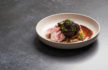 Lamb meat with pickled radish, mushrooms and demi glace sauce