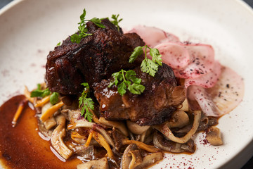 Lamb meat with pickled radish, mushrooms and demi glace sauce