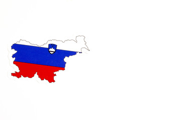 National flag of Slovenia. Country outline on white background with copy space. Politics illustration