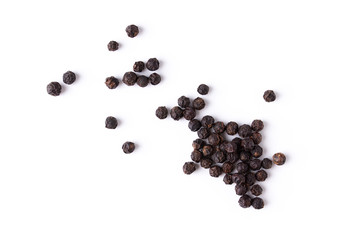 Black pepper viewed from above on white background. Flat lay