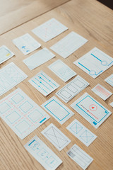 High angle view of layouts of user experience design on wooden table