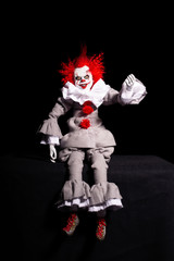 scary clown killer on a black background. horror. Halloween concept. creepy look.