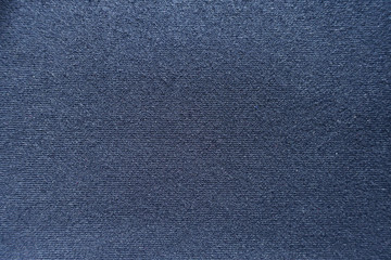 Surface of dark blue jersey fabric from above