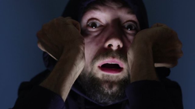 scared terrified man face expression close up