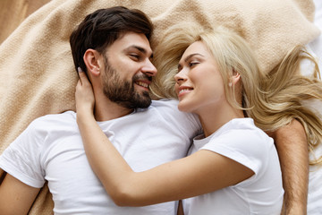 Happy together. Love. Fun. Emotions. Young couple are hugging and laughing