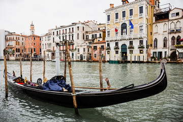Plakat canal with gondola and ancient buildings in Venice, Italy