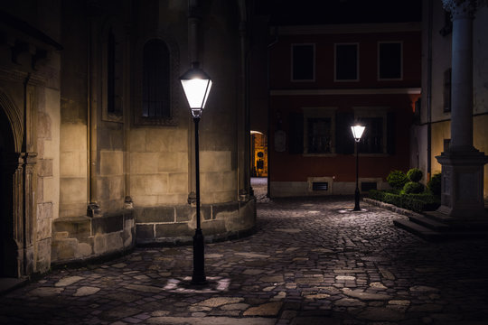 Illuminated Street At Night. Old European City