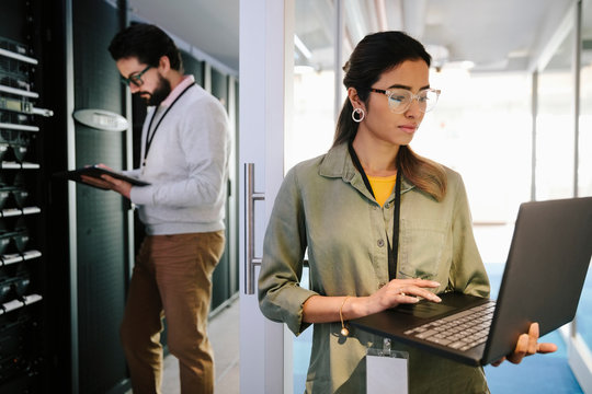 IT Technicians Working In Network Server Room