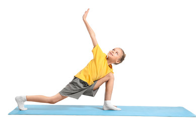 Little girl practicing yoga on white background