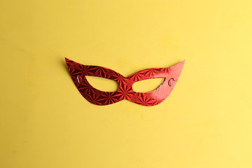 Party cardboard mask on colorful background
