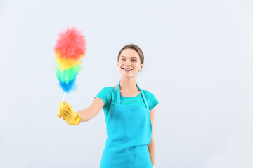 Portrait of janitor on light background