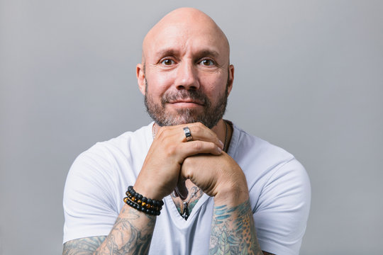 Portrait confident man with beard and tattoos