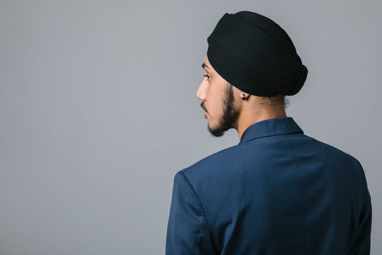 Thoughtful young Indian businessman wearing turban