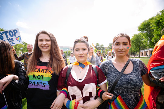 Portrait of three female students at gay pride festival
