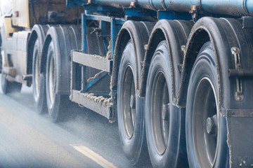 Obraz na płótnie Canvas Truck wheels on road in motion
