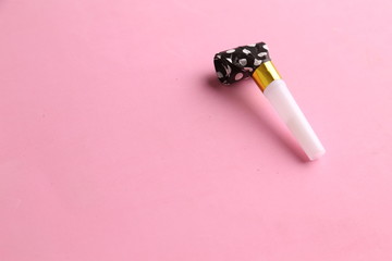 party whistle on colorful background