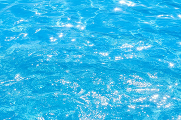 Obraz premium Blue and bright pool water with solar reflection, water ripple Movement and gentle wave in the pool