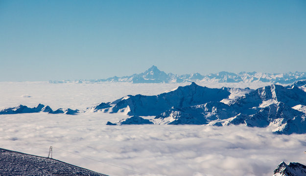 Zermatt Breuil cervinia sea of clouds in valley mountains emerging view perfect sky