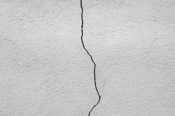 crack in the concrete wall close-up. grunge background