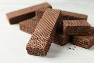 Sweet wafers on white wooden background, close up
