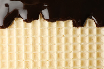 Wafer with chocolate topping texture background, close up