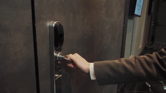 Hotel receptionist opens the door to the conference room