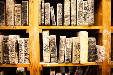 In the workshop for lithography.  Lithography stone on shelf