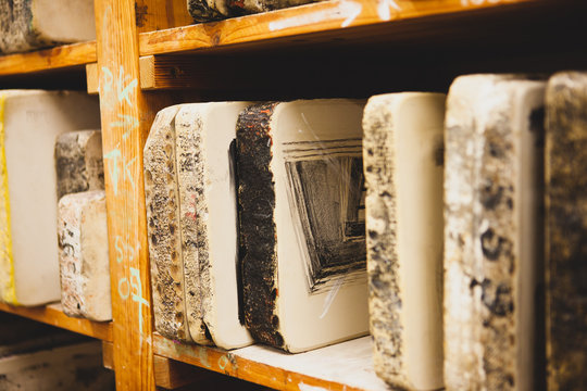 In the workshop for lithography.  Lithography stone on shelf