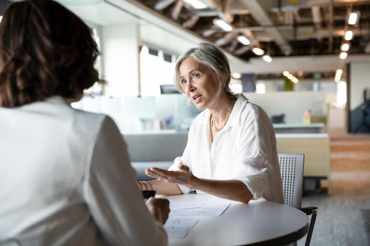 Senior Woman Discussing With Financial Advisor