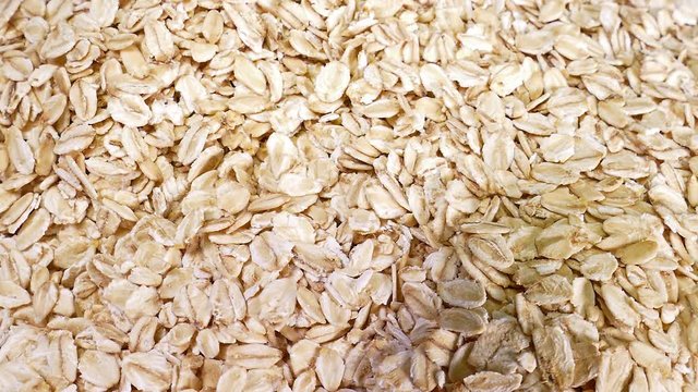 Oat Flakes Oatmeal Healthy Diet Food Closeup Texture Pattern Background Video Clip Rotating Plate