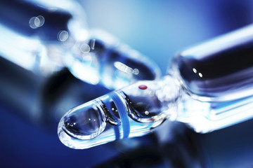Ampoles with medicine in blur. Ampoules with injection in blue.