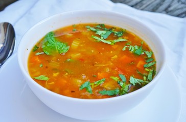 A bowl of hot and sour vegetable soup at an Indian restaurant