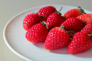 group of strawberries on white dish