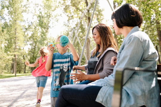 Children With Two Mothers In The Park