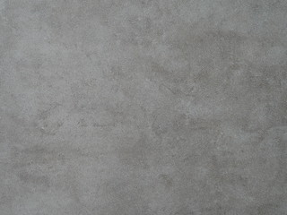 Cement wall with texture and different shades of gray