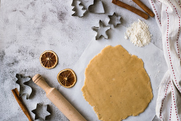 Cooking Christmas gingerbread cookies on a gray background