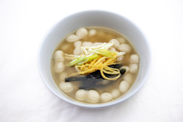 Korean style rice cake soup which is called Jolaeng-i Ddukkuk eats on the Lunar moon new year