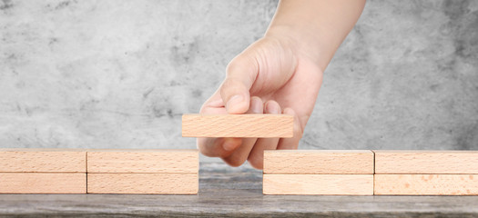 Hand arranging wood block . Business concept growth .