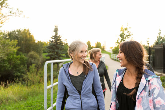 Women Wearing Sports Clothing Walking In Park