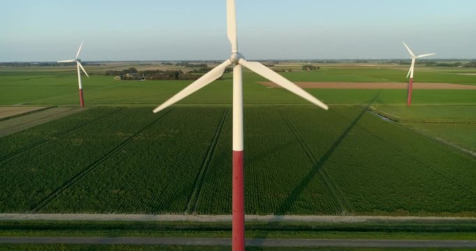 Three Turbines on a Wind Farm Producing Renewable Green Energy, Rising Shot Close Up - Barradeel, Friesland, The Netherlands &ndash; 4K Drone Footage