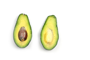 cut avocado isolated on white background. Horizontal image. Flat lay