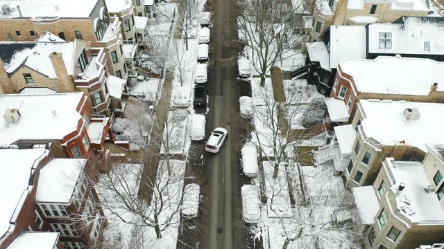 Birds Eye View of Car Parallel Parking in Winter on City Street