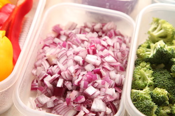 Red onion chopped up in container